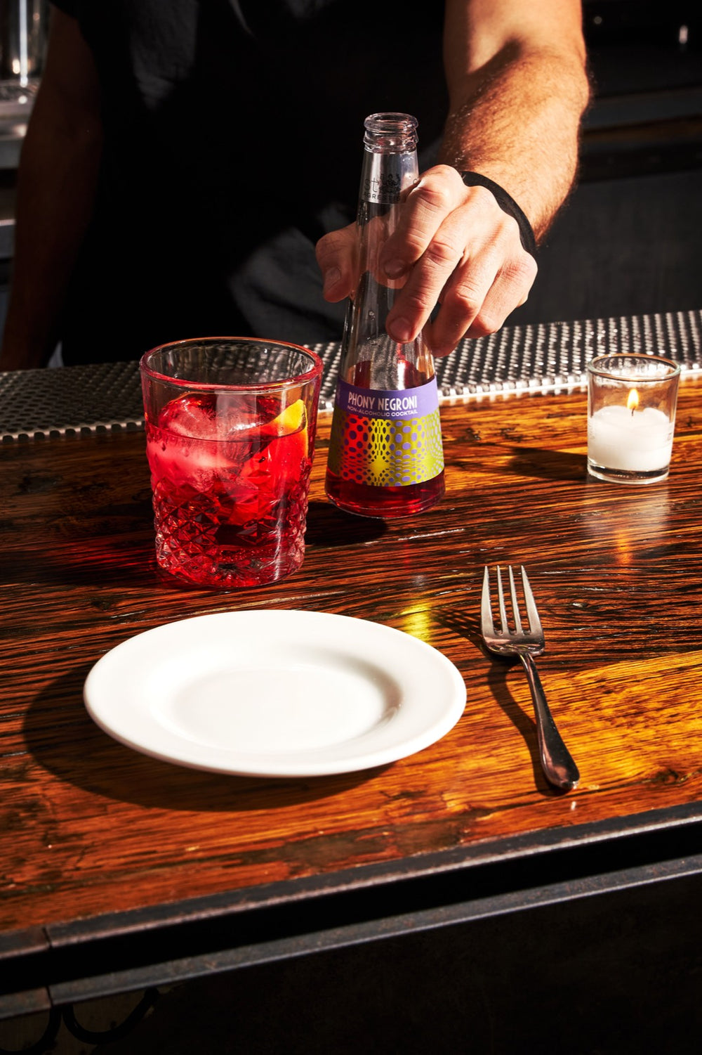 On the bar, by candlelight