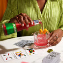 Pouring a St. Agrestis non-alcoholic aperitif into a glass