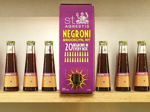 Alcohol-free cocktail bottles displayed beside a St. Agrestis Negroni box labeled Brooklyn, NY