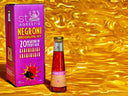 Top Negroni mocktail bottle displayed beside a vibrant purple box against a shiny gold background
