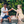 Load image into Gallery viewer, Alcohol free negroni in a glass being toasted between two people relaxing by a poolside.
