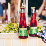 Phony Mezcal Negroni bottles on a dinner party table