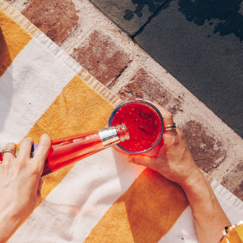 Phony Negroni being poured into a glass