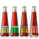 St. Agrestis non-alcoholic cocktail core four starter pack featuring Phony Negroni, Mezcal Negroni, Espresso Negroni, and Amaro Falso bottles.